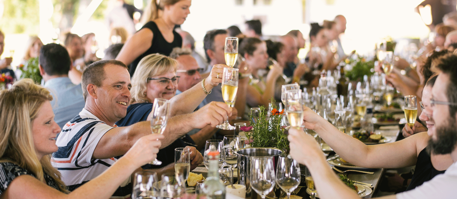 Guests enjoy wine at Oliver Winery's Creekbend Vineyard.
