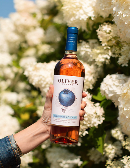A group of women cheers with Cherry Moscato.